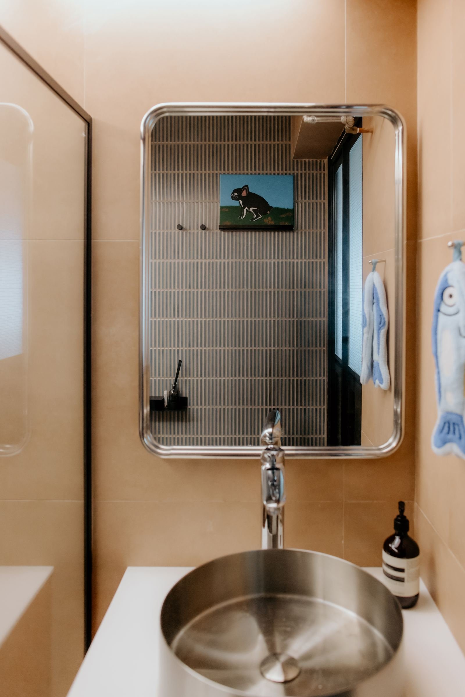 Bathroom mirror and mosaic tile detail