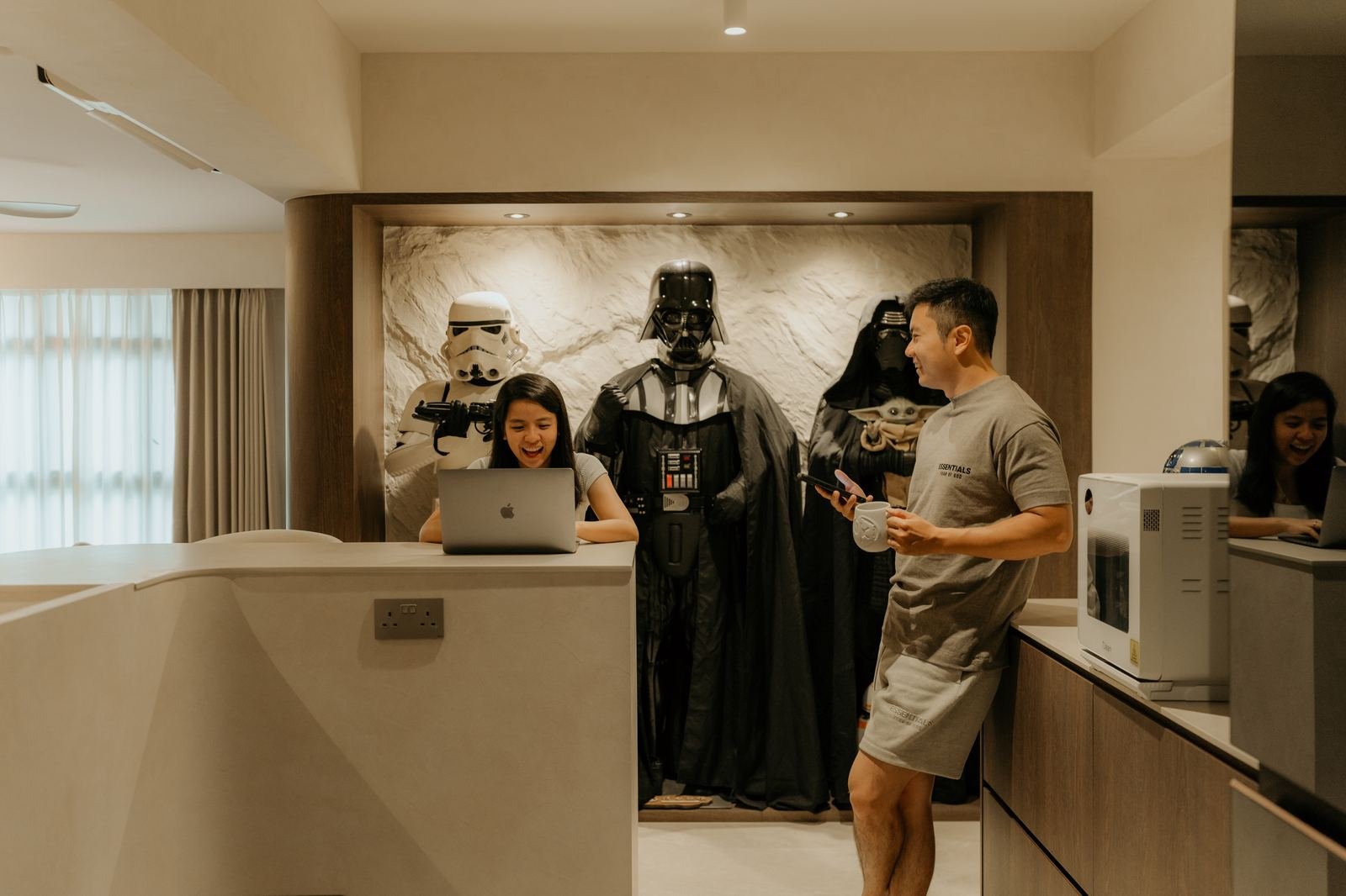 Couple in a home with a Star Wars display wall